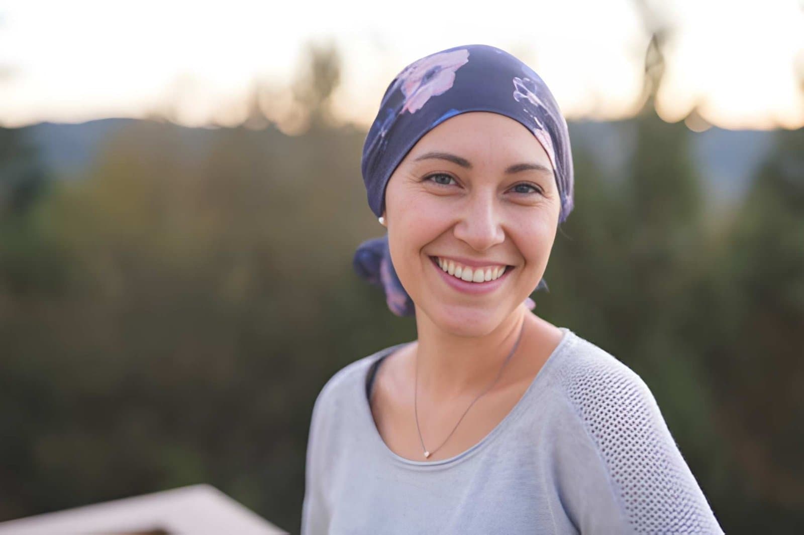 Smiling woman wearing a head scarf outdoors
